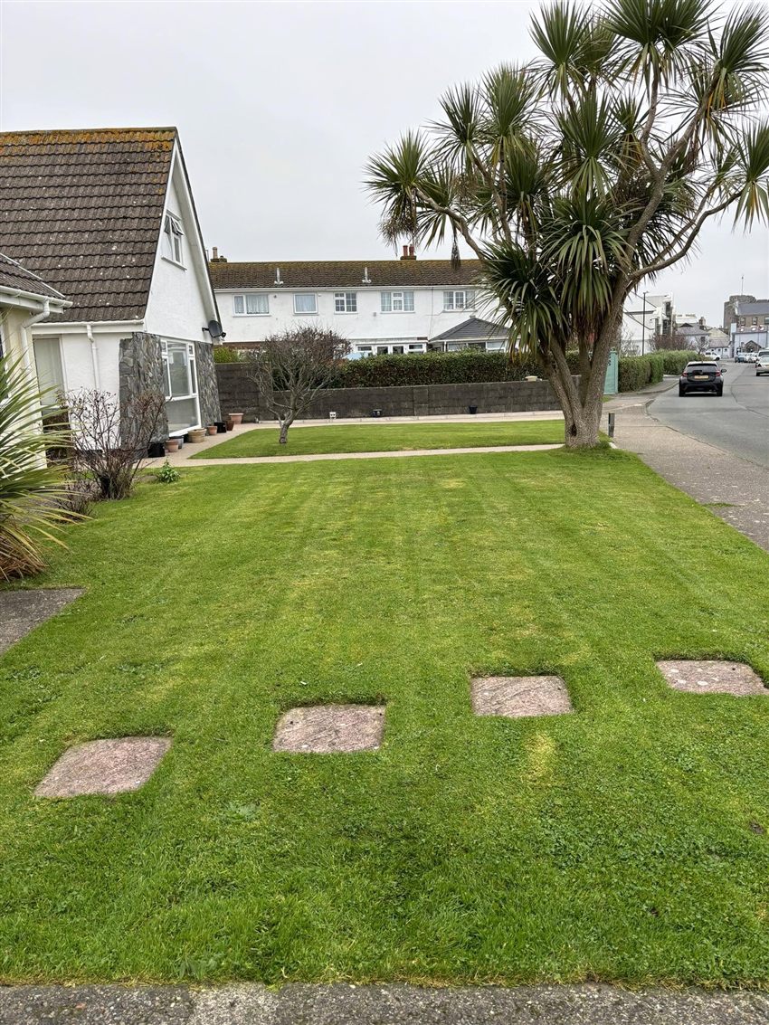 Freshly mown front lawn by the road