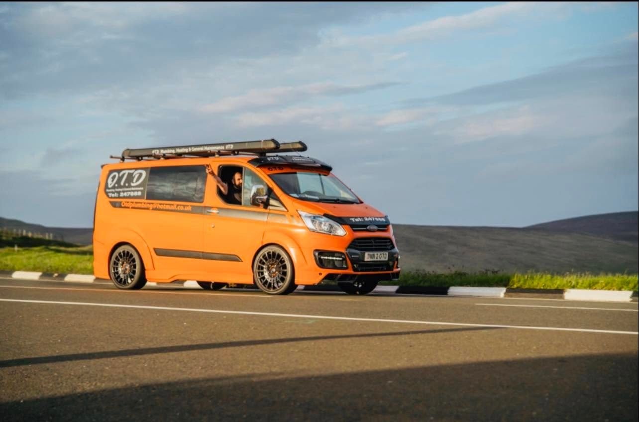 OTD Plumbing & Heating's branded van on an Isle of Man mountain road
