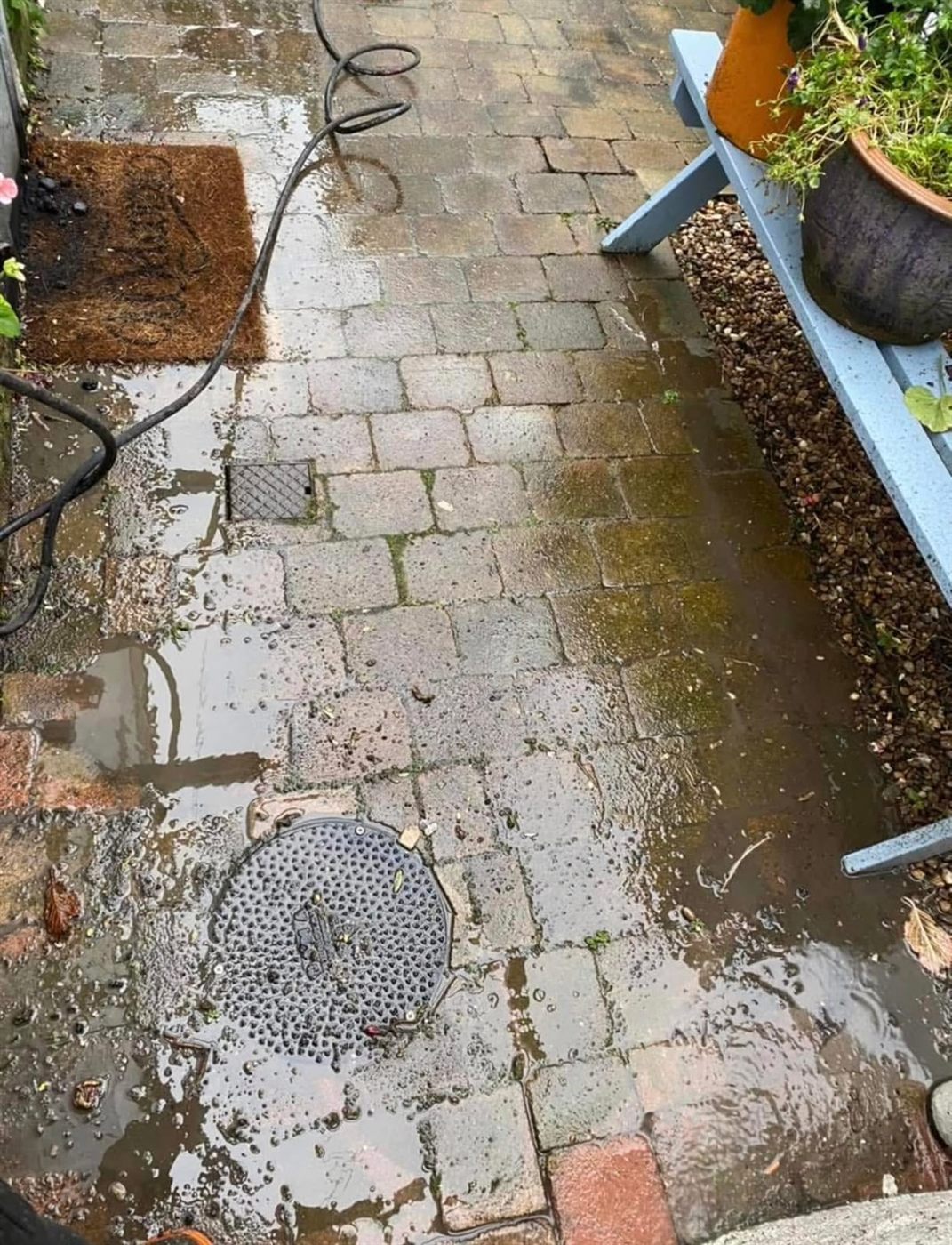 Brick paving part way through jet washing