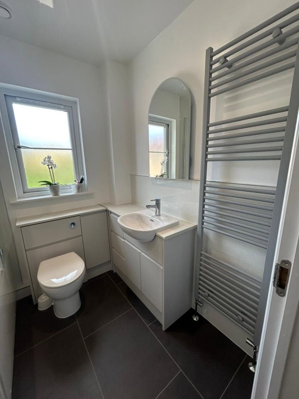 Bright family bathroom with heated towel rail