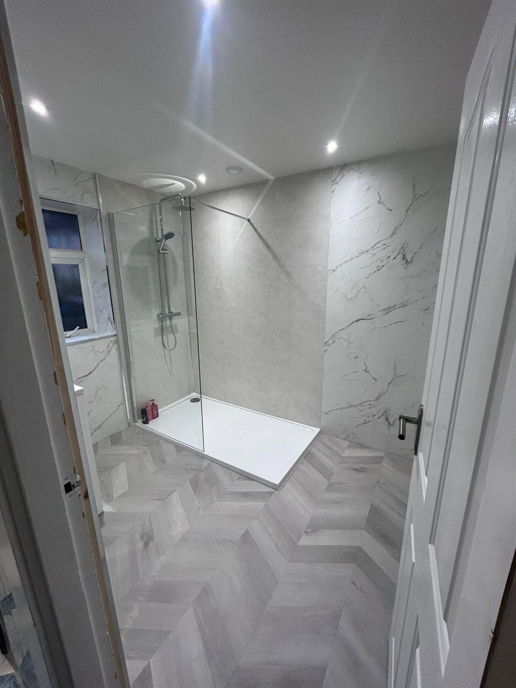 Marble-effect walk-in shower room